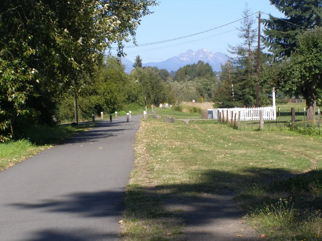The Centennial Trail running between woods and open fields near Lake Stevens, WA