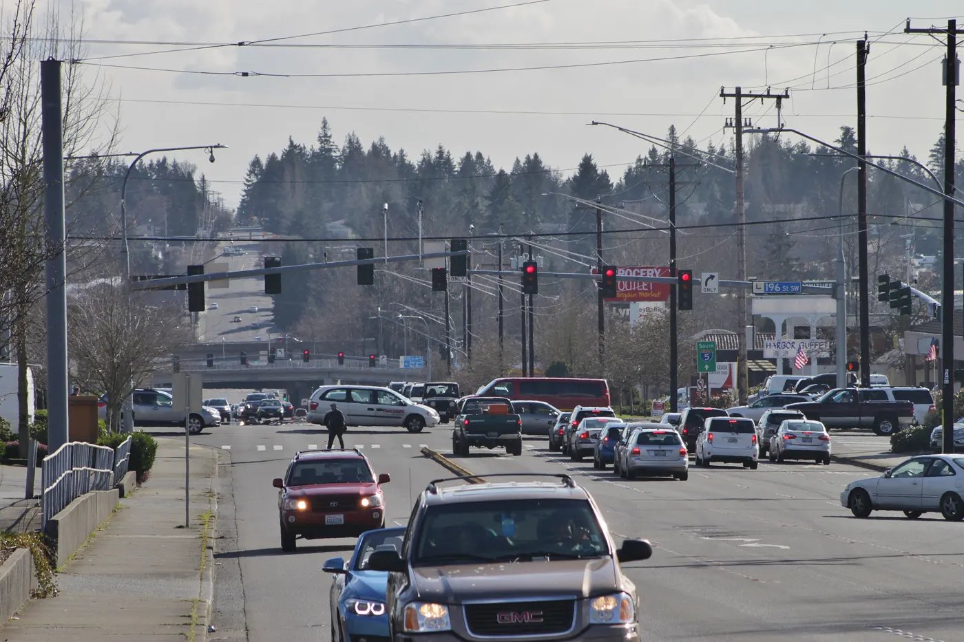 Looking south on 44th Avenue W in Lynnwood, WA, a busy arterial lined with shops and apartments
