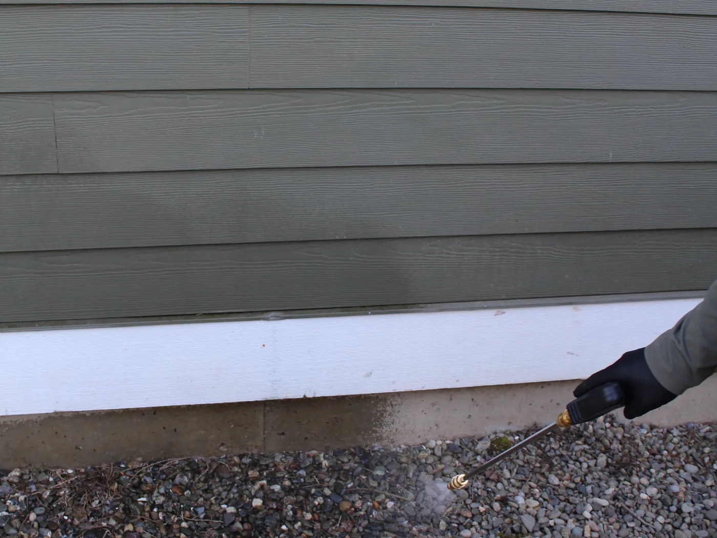 Pure Guard treating along a home's foundation line where ants trail in, Lake Stevens, WA